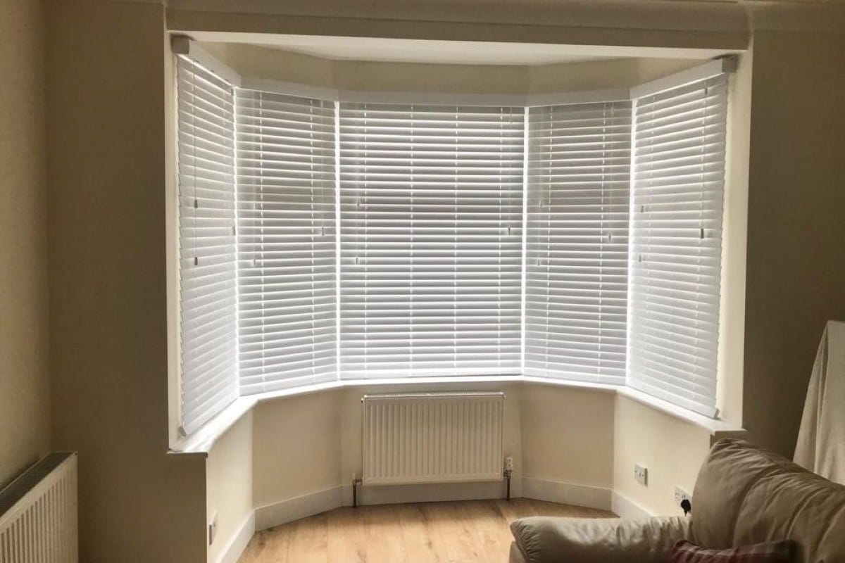 After we installed Faux Wood Venetians in a Bay