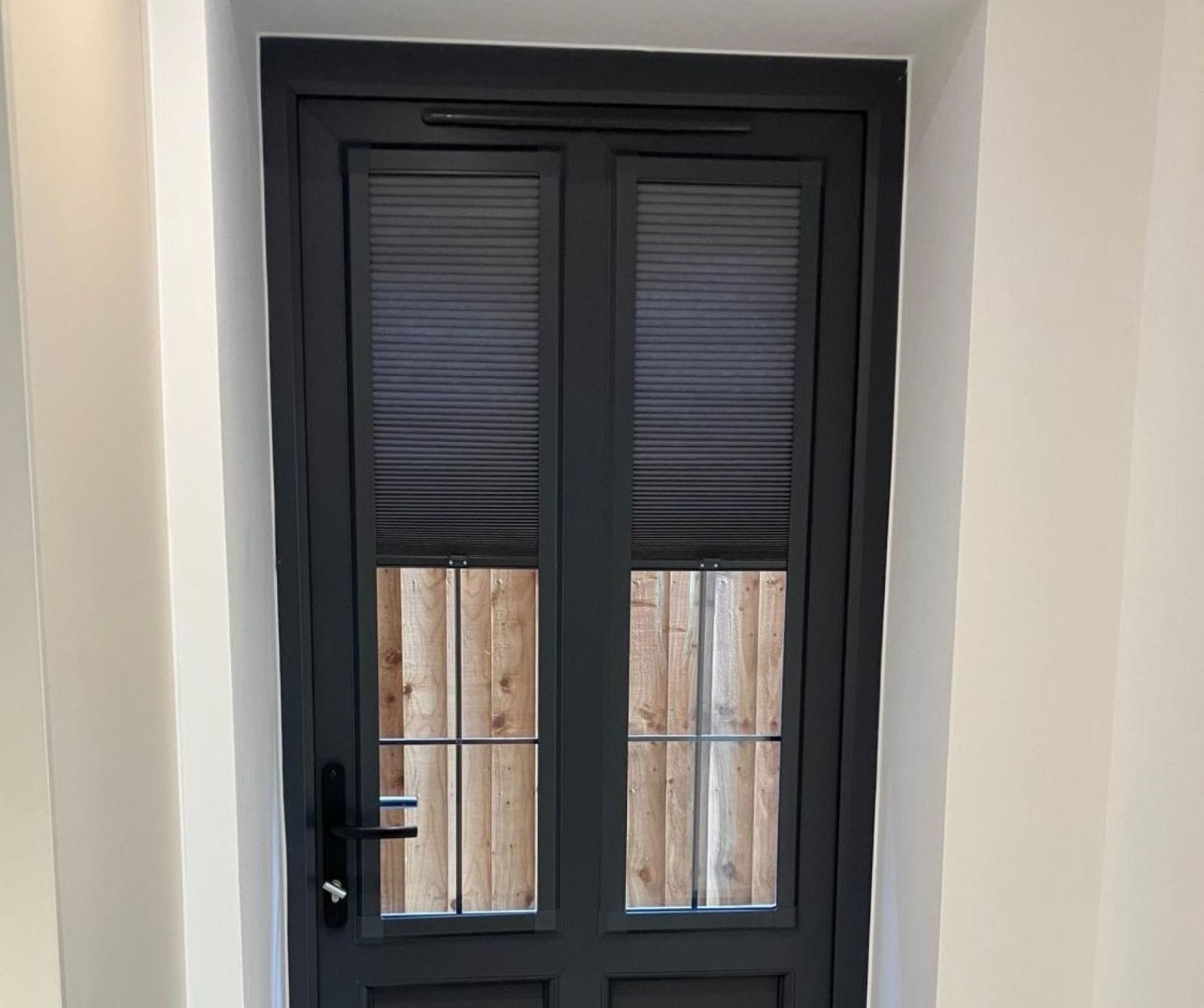 Perfect Fit Cellular Blinds for Anthracite Doors Perfect Fit Cellular Blinds installed on anthracite grey doors by John’s Blinds & Curtains, combining energy efficiency with a clean, contemporary look.