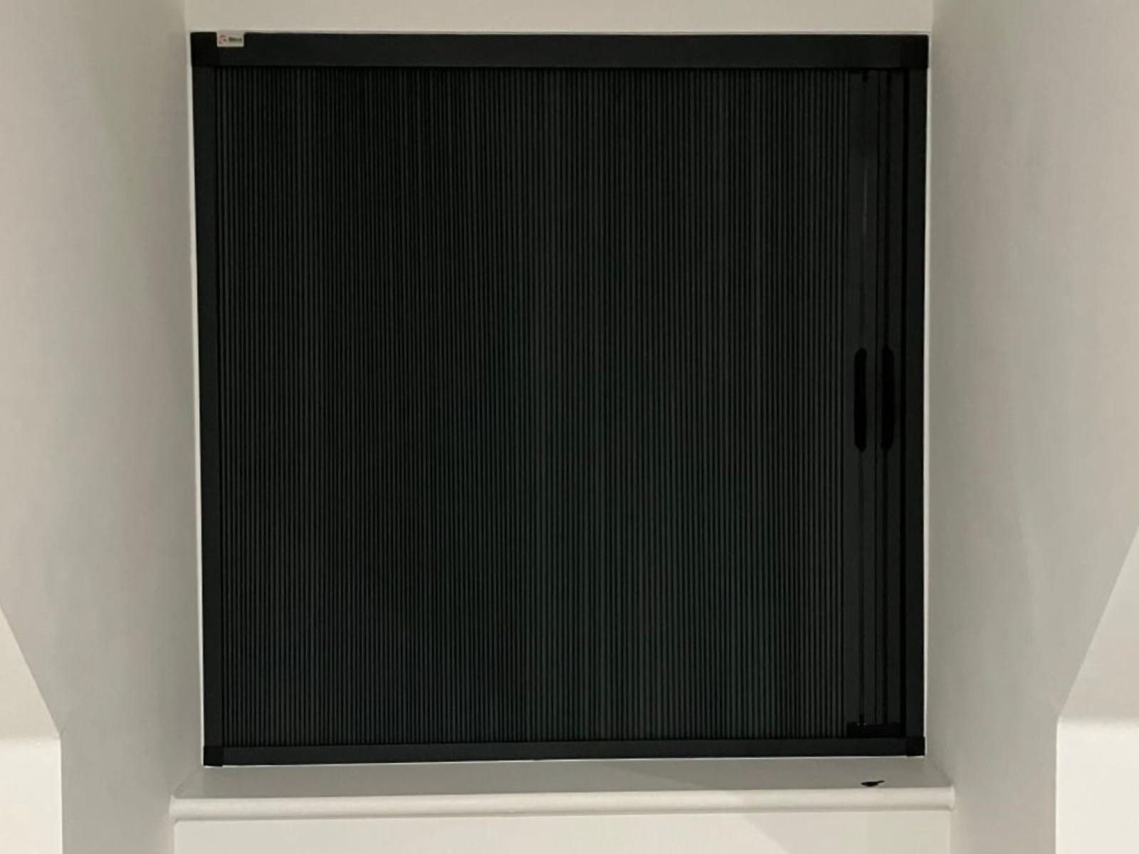 Thermal efficient blackout Blind Screen fully closed, providing complete light control and insulation, fitted by John’s Blinds & Curtains.