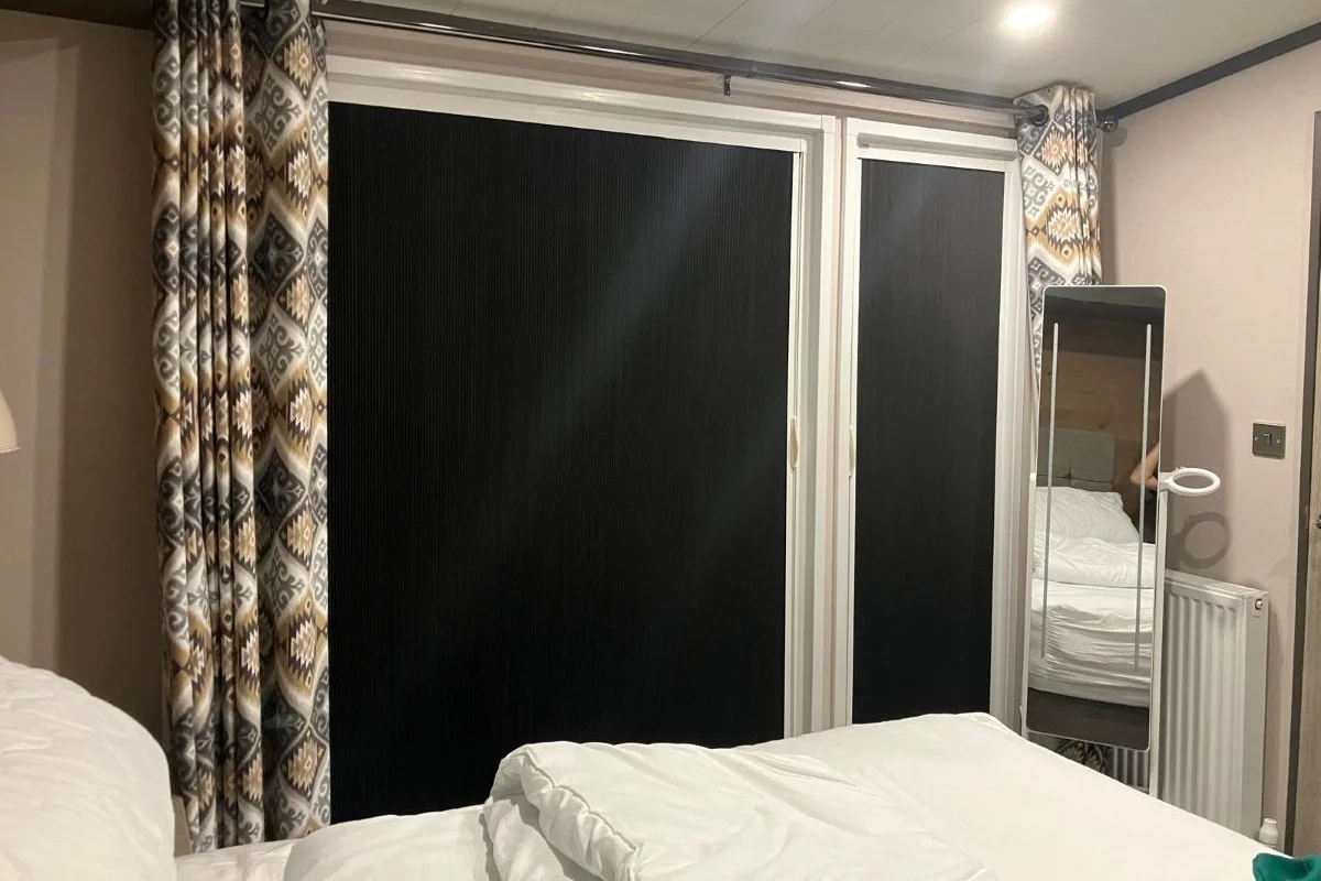 Blind Screen Blackout Blind Installed in Bedroom Blind Screen blackout blind fully closed across a bedroom window