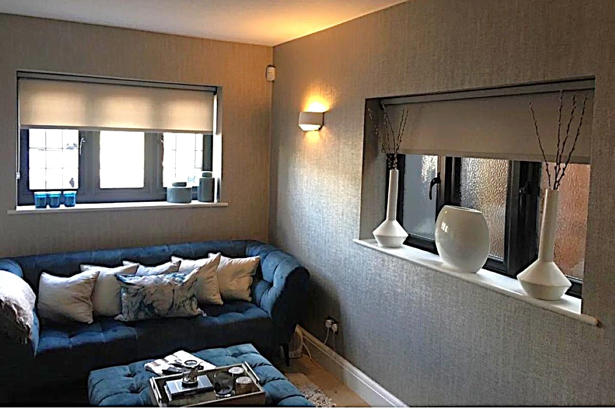 Cassette roller blinds fitted in a modern living room window, providing a clean, minimal shading solution.