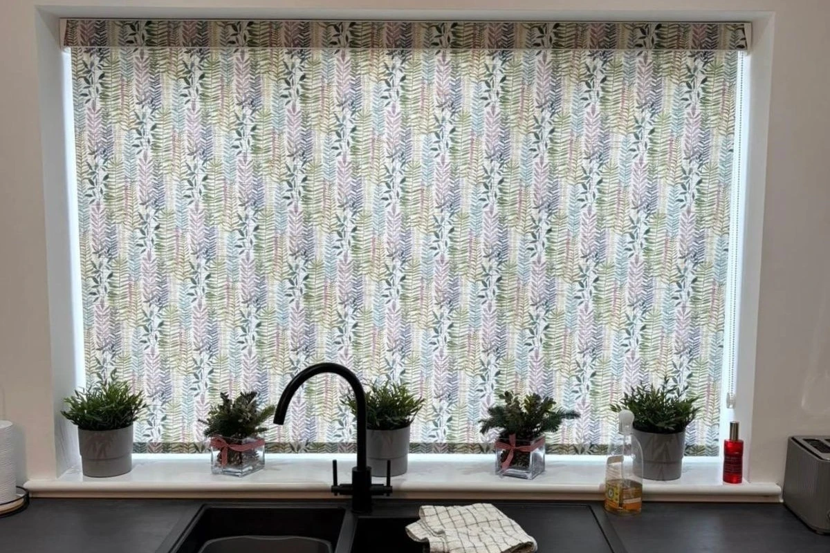 Botanic Pattern Cassette Roller Blind in Kitchen Patterned cassette roller blind fitted above a kitchen sink window, providing privacy and easy cleaning.