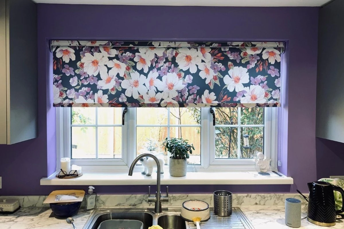 Floral Roller Blind in Kitchen Sink Window Floral roller blind fitted inside a kitchen sink window with a patterned fabric