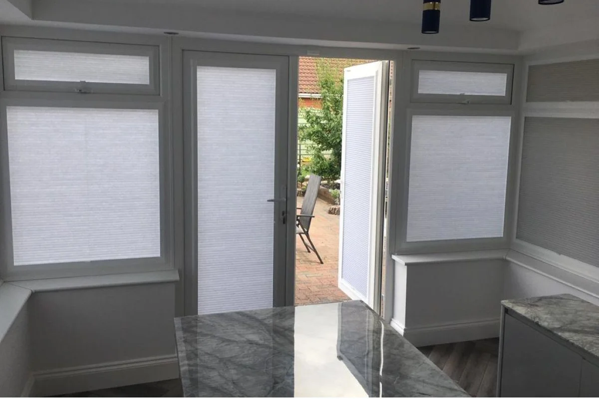 Perfect Fit cellular blinds fitted to uPVC windows, helping improve insulation and reduce heat loss in a modern home