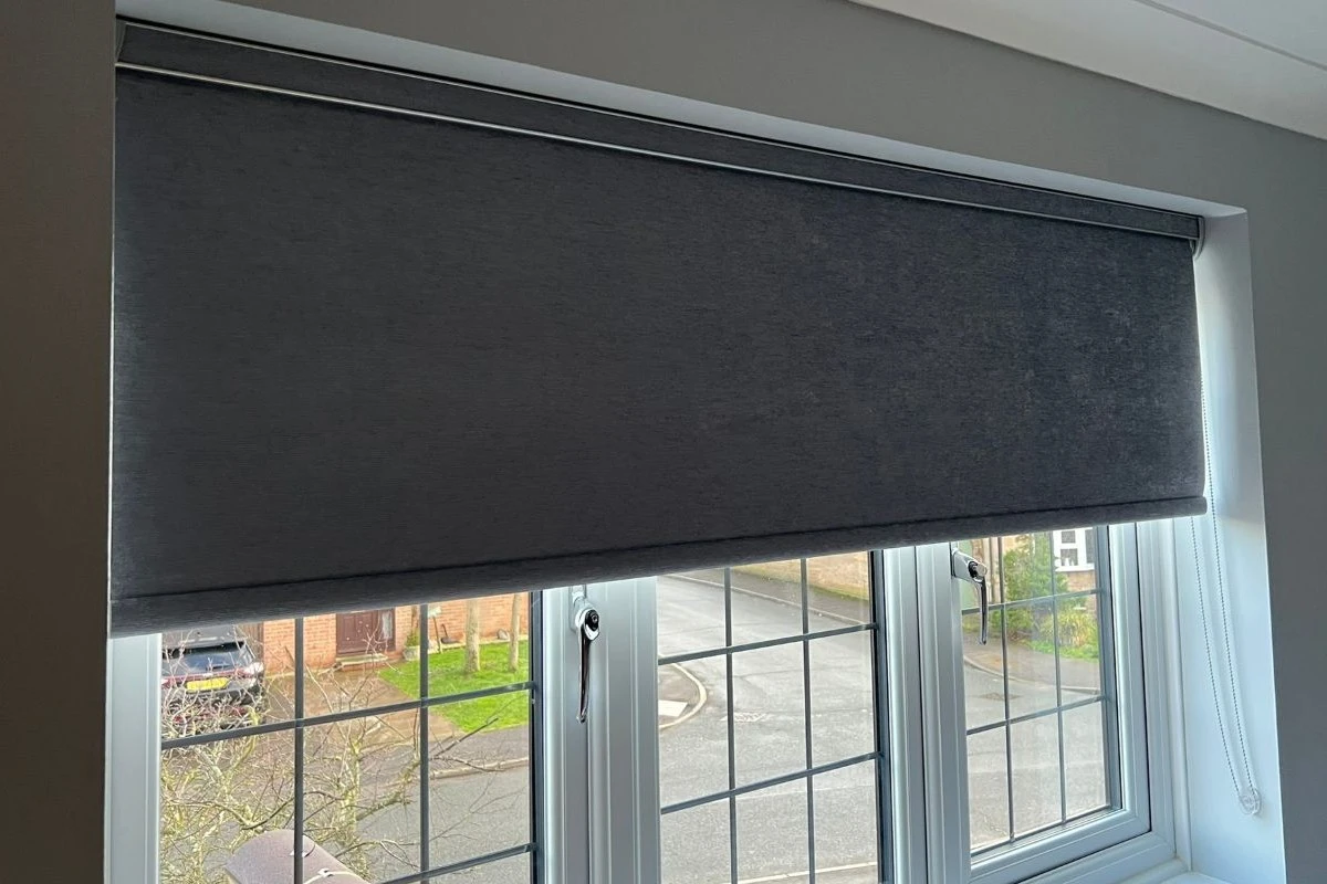 Grey Blackout Roller Blind in Bedroom Grey blackout roller blind fitted in a bedroom window