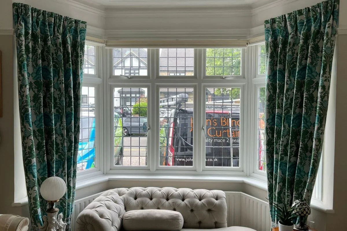 Triple Pinch Pleat Curtains. Ideal for your Bedroom Triple pinch pleat curtains in a floral fabric, suitable for adding warmth and softness to bedroom spaces