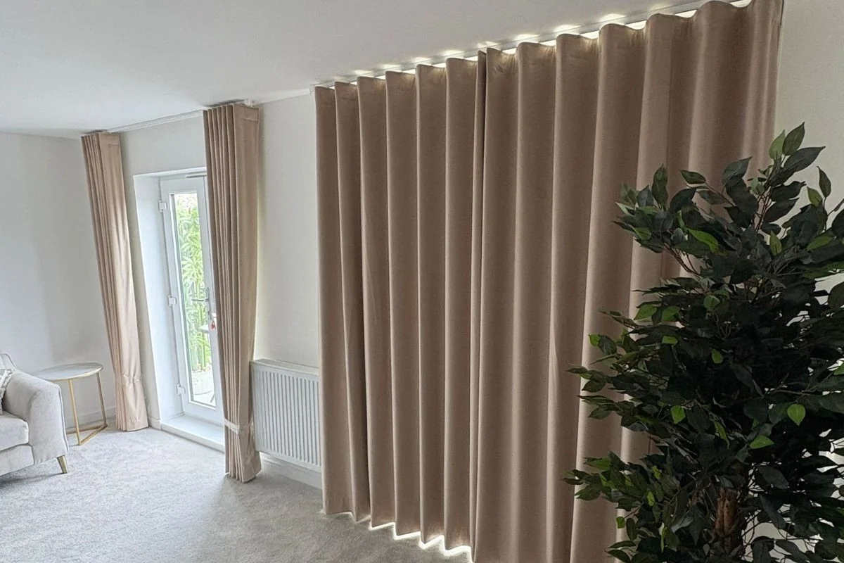 Beige Wave Curtains – Ideal for Soft Bedroom Styling Beige wave curtains on a wave track, ideal for creating a soft and modern look in bedroom spaces