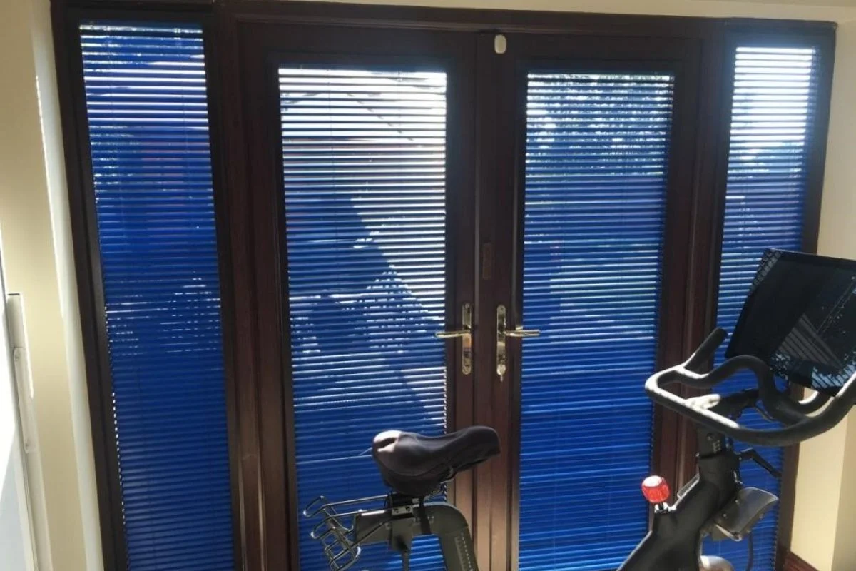 Perfect Fit Venetian blinds fitted to glazed doors in a home office