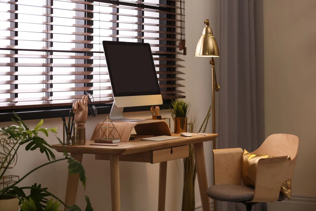 Wood Venetian blinds providing adjustable light control in a home office