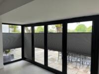 Perfect Fit multi-zone cellular no-drill blinds fitted to black aluminium bifold doors