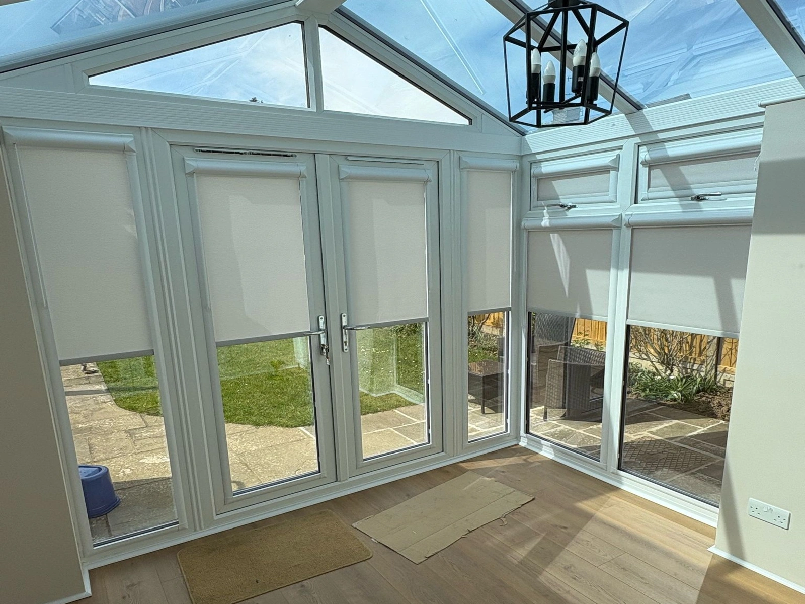 Perfect Fit roller blinds fitted to white uPVC doors and windows without drilling