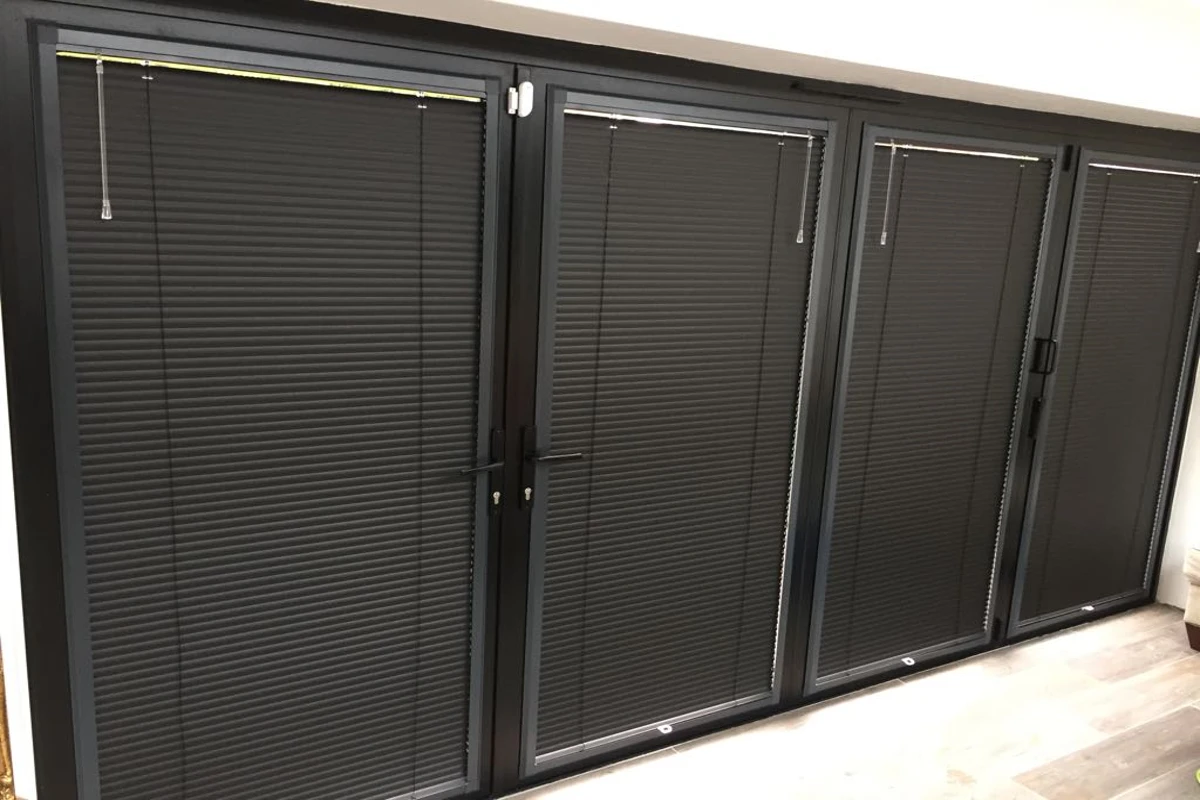 Perfect Fit cellular blinds installed on anthracite bifold doors