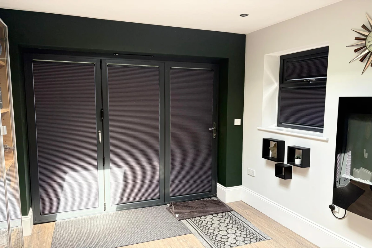Cosiflor pleated blinds installed on anthracite bifold doors