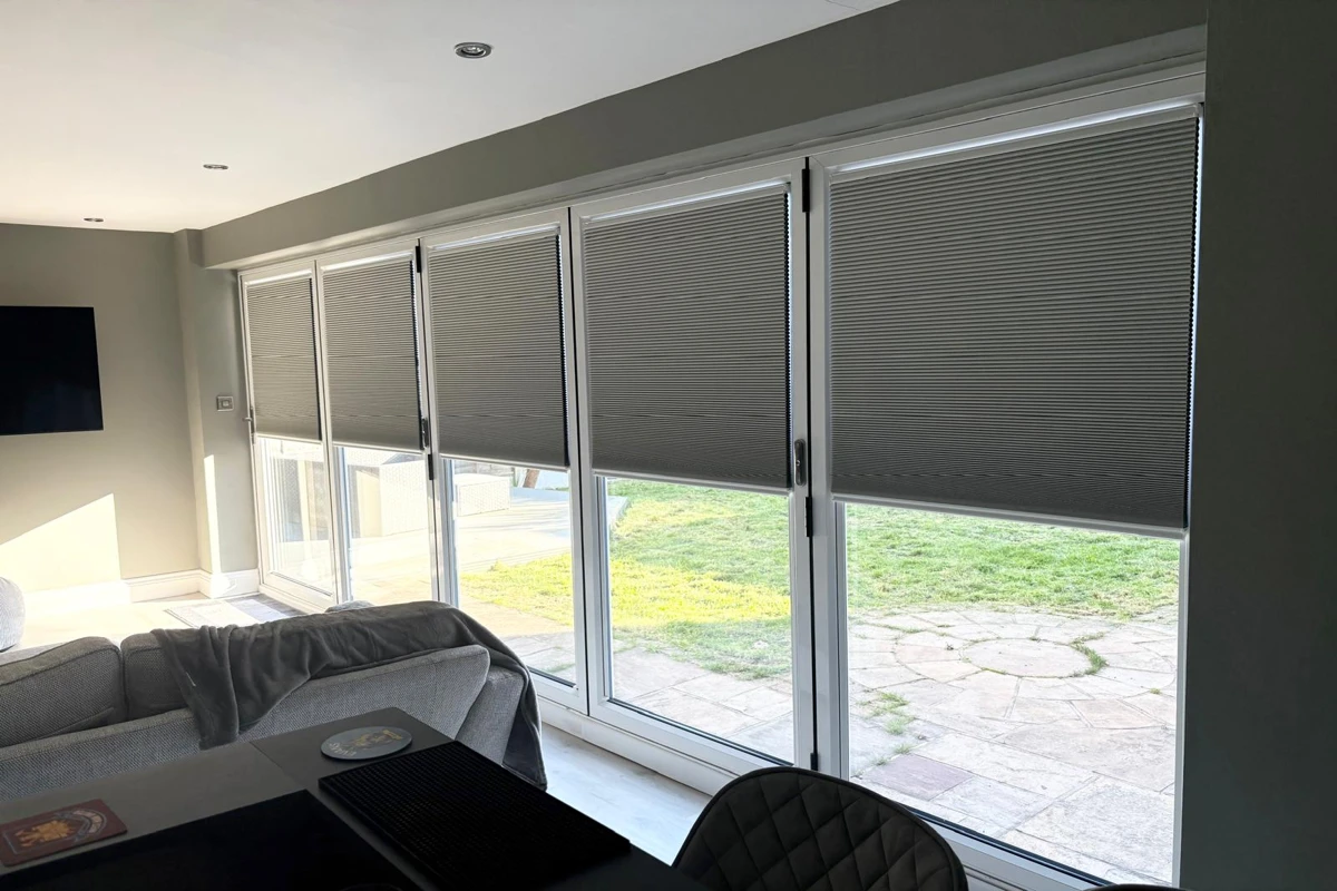 Cosiflor pleated blinds installed on white bifold doors