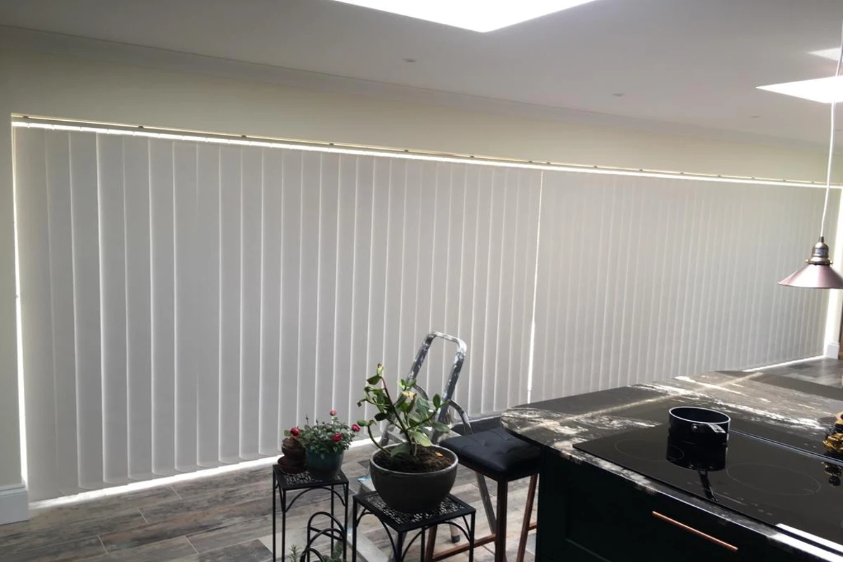 vertical blinds installed across wide bifold doors - made in Wickford