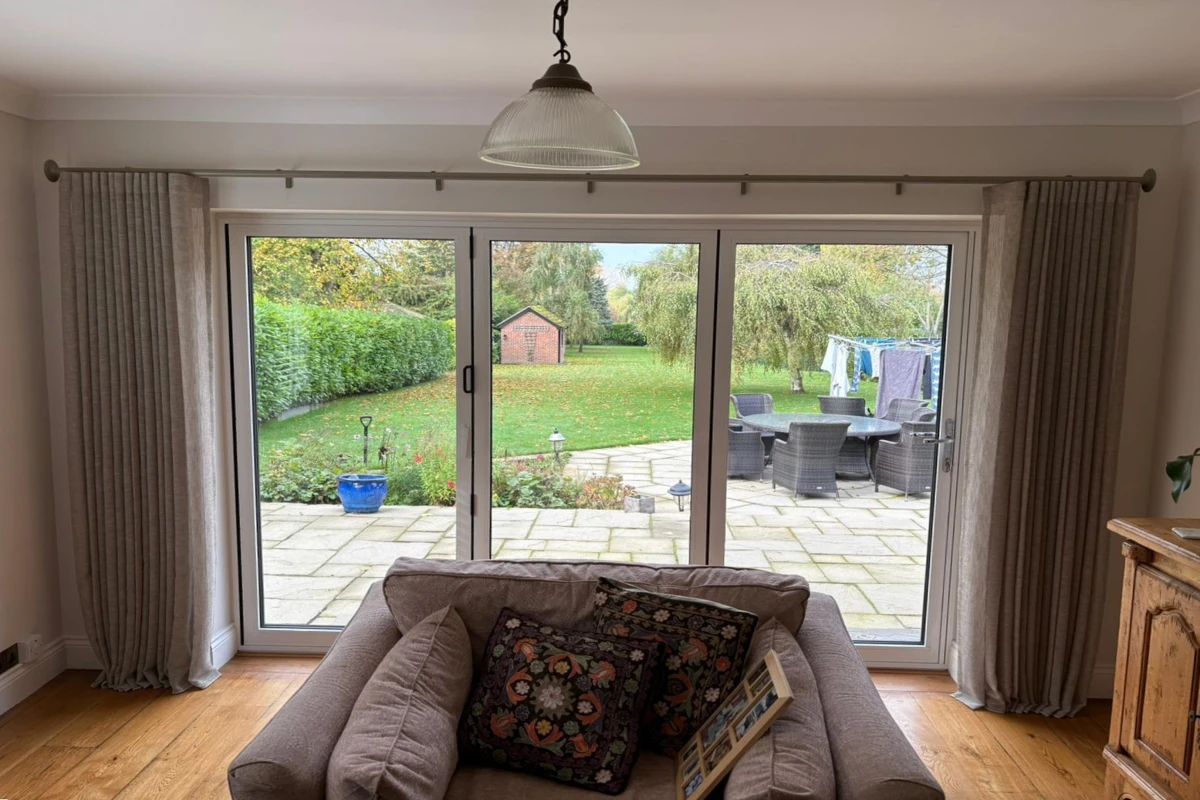 sheer wave curtains installed over bifold patio doors