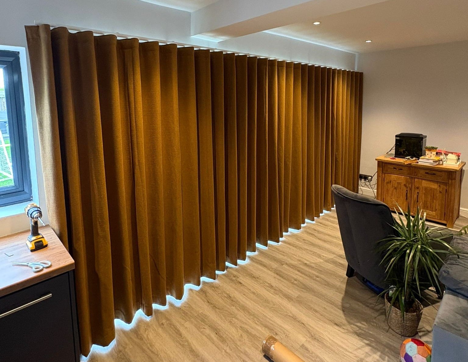 Bespoke wave curtains fitted across a wide window in a modern Essex home
