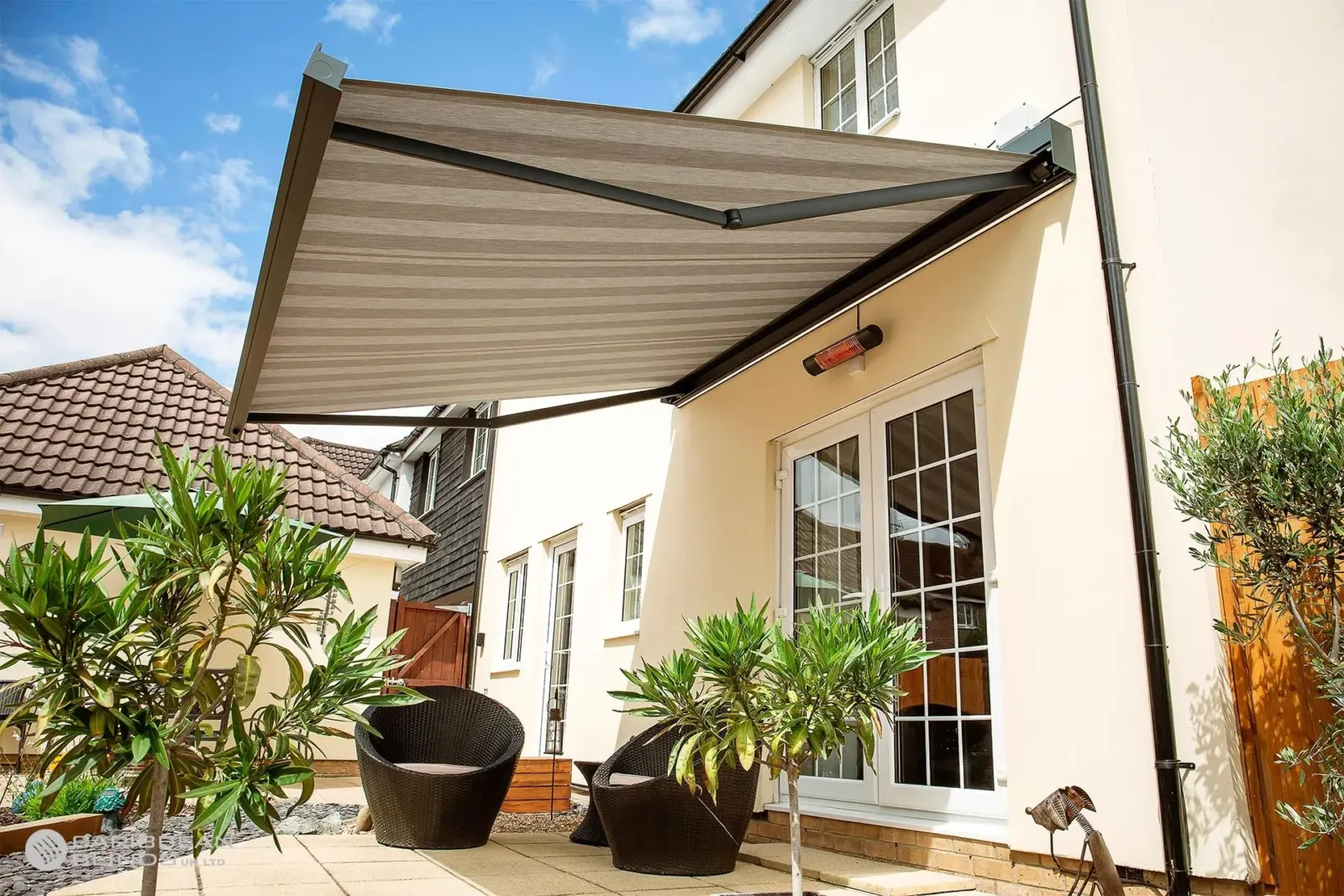 Retractable patio awning shading modern garden seating area