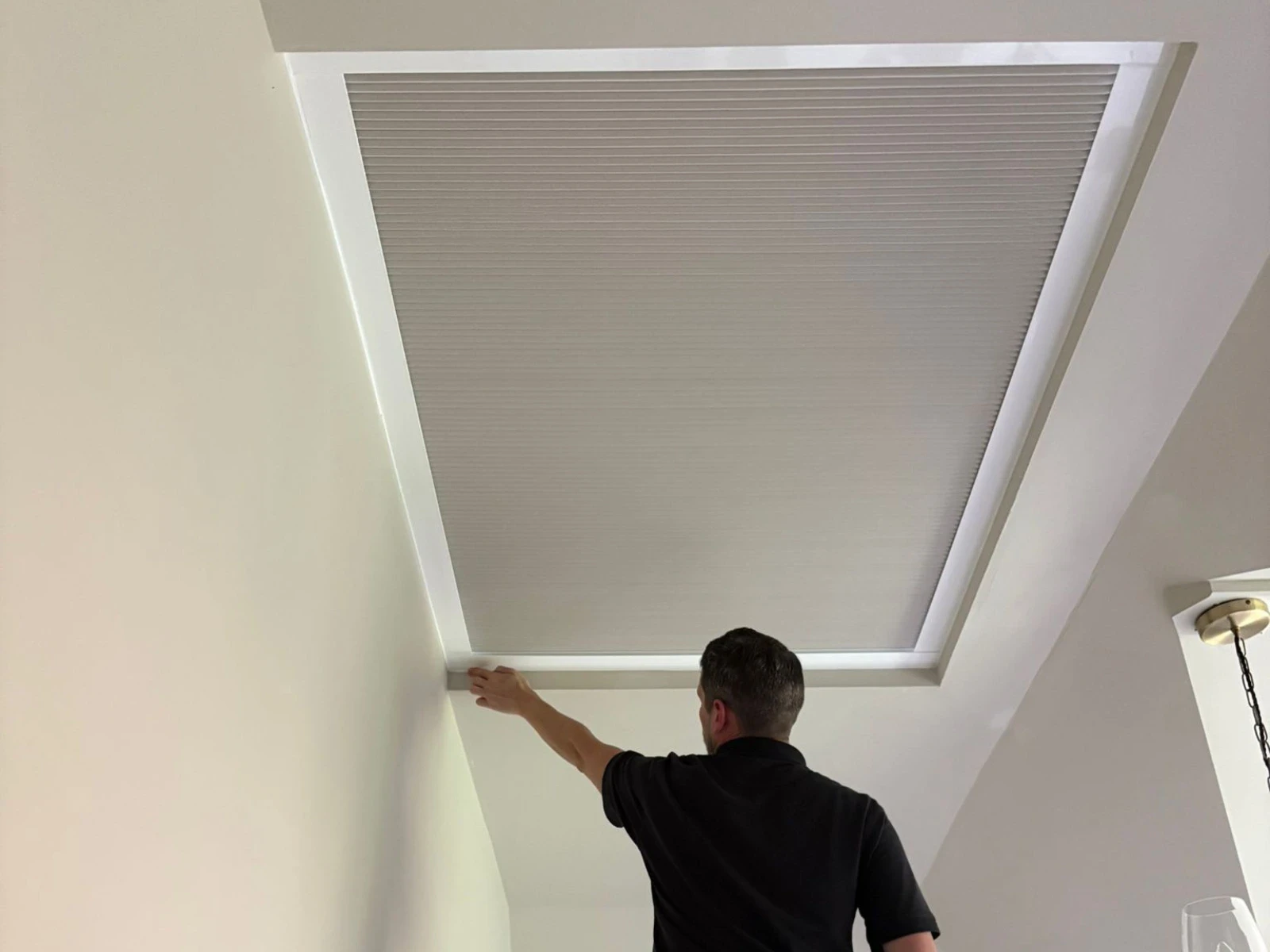 Made to measure cellular roof lantern blind installed in a modern home in Essex, providing insulation and light control.