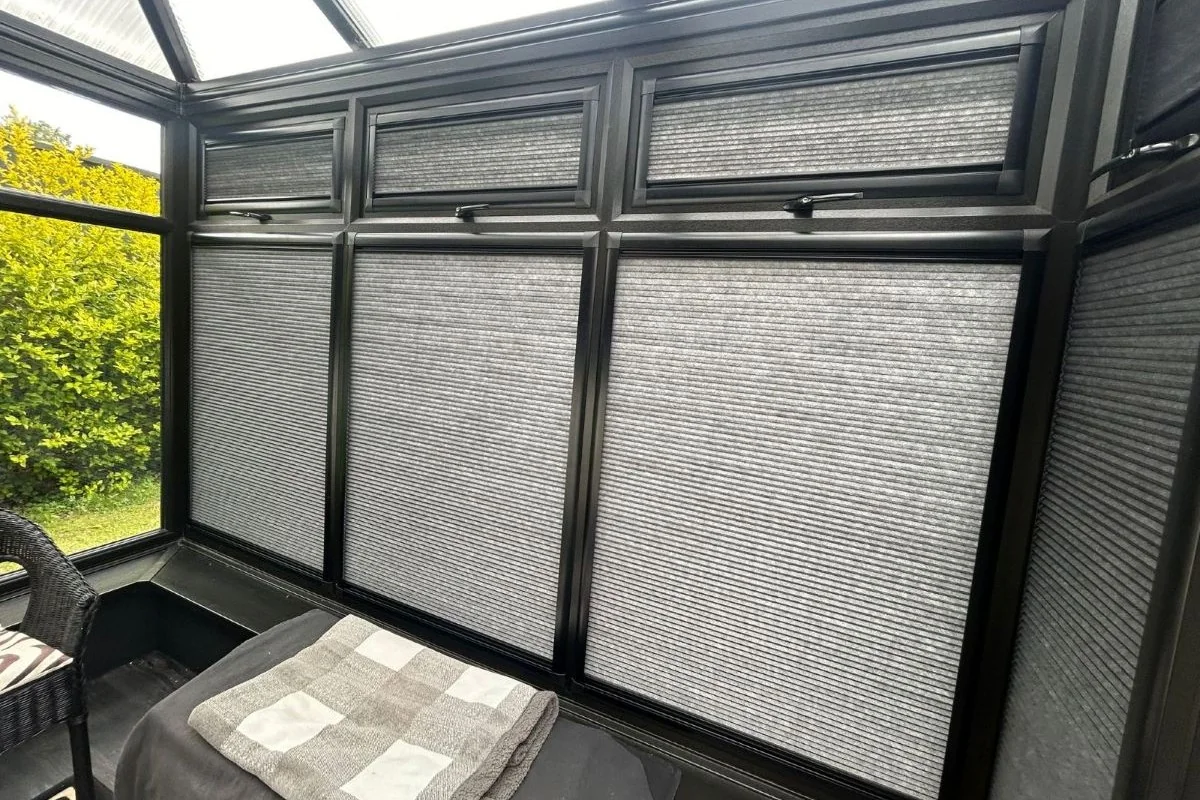 Perfect Fit Maxline Cellular Blinds Grey Perfect Fit Maxline cellular blinds fitted to black-framed conservatory windows.