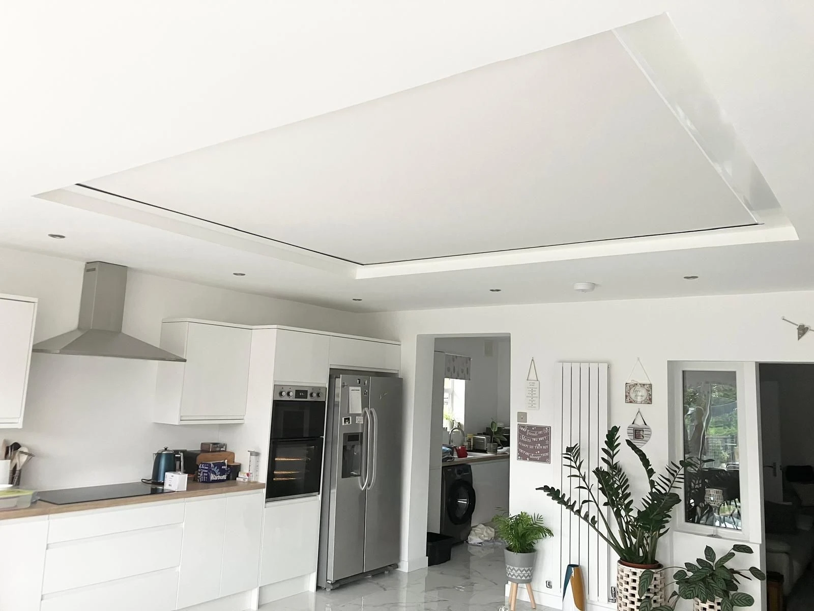 Made to measure roller roof lantern blind installed in a modern Essex home, providing stylish light control for a large roof lantern