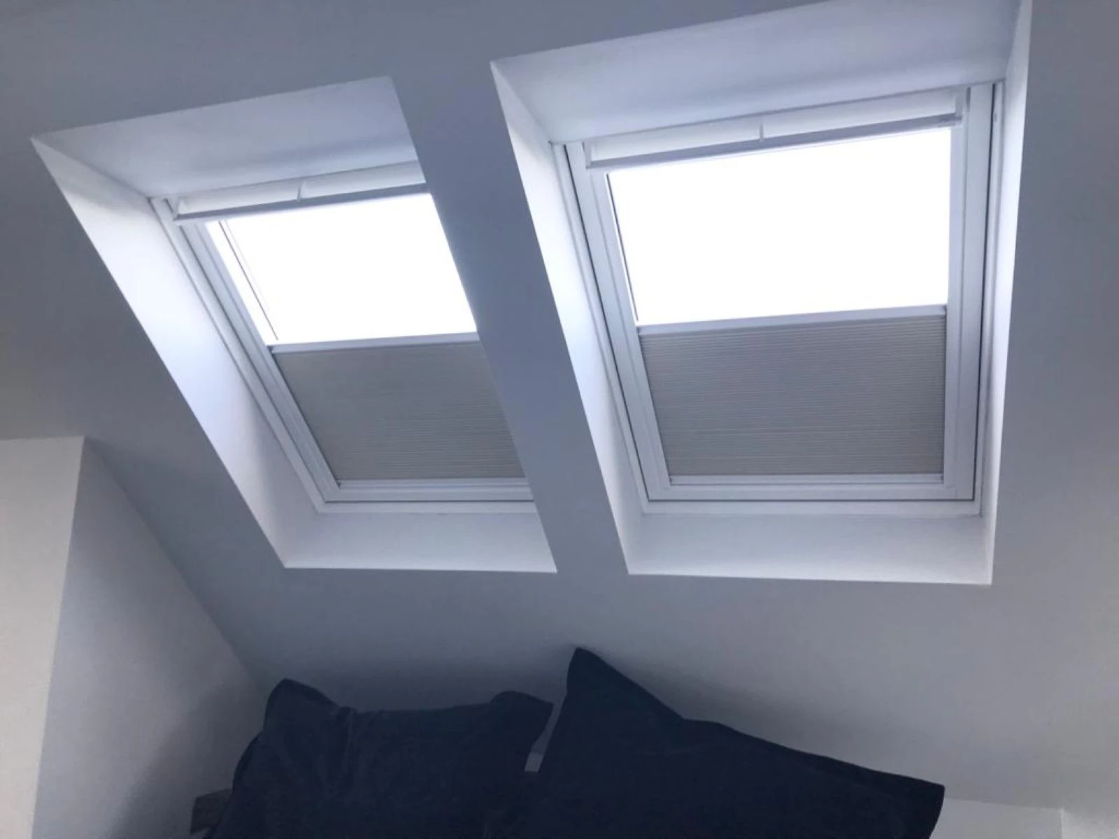 Genuine Velux® pleated roof window blinds installed in a modern Essex home, providing light control, privacy and improved thermal insulation.