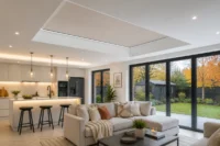 Modern open-plan kitchen and living room with a made-to-measure roof lantern blind installed across the internal roof lantern opening to help improve comfort during the colder months
