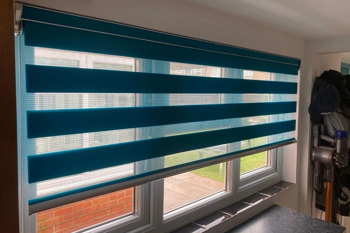 Day & Night blind installed on a wide window, demonstrating how the alternating fabric bands can provide privacy while maintaining natural light.
