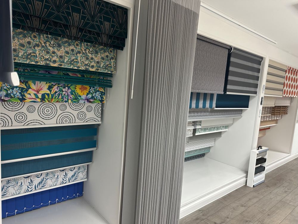 Family-run John’s Blinds & Curtains showroom featuring curtain fabrics, blind displays and design choices.